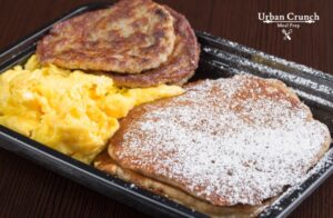 Protein pancakes with sausage patties and eggs